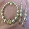 E2
White pearls and silver beads with heart charm